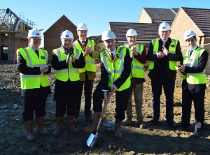 Corby Deputy Mayor Cllr Dady (Centre) surrounded by (l-r) Cllr David Sims, Leader of the Council Tom Beattie, Nick Bolton and Joe Dickinson from Electric  Corby, Alfred Buller from Bela Partnership and John Lagan of Lagan Homes